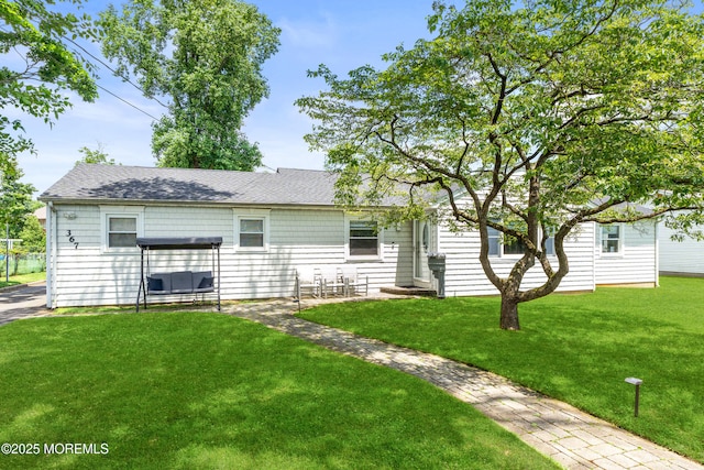 367 Kirby Ave, Long Branch, NJ 07740 - back of property with a yard and roof with shingles
