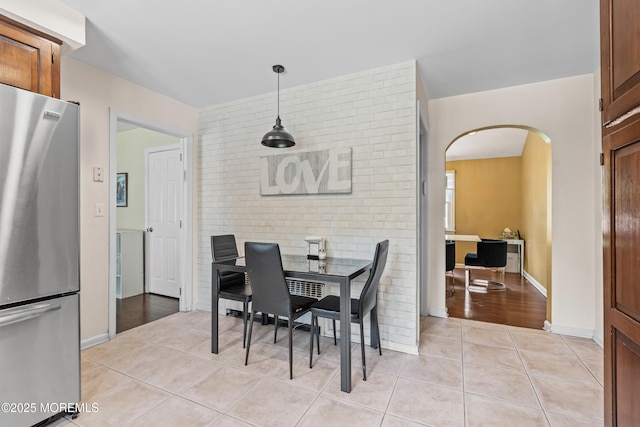 367 Kirby Ave, Long Branch, NJ 07740 - dining room with arched walkways and light tile patterned floors