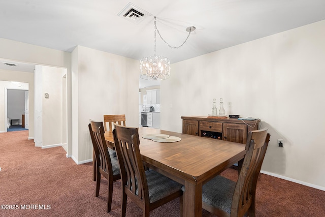 1058A Argyll Cir, Lakewood, NJ 08701 - carpeted dining space featuring a chandelier and baseboards