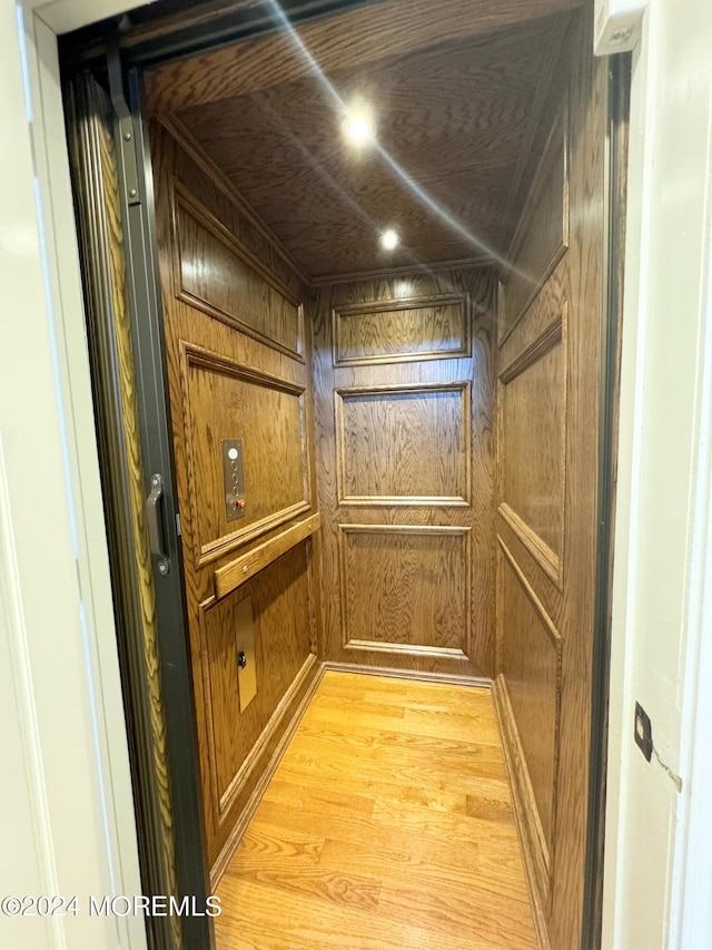 5-4 Main St, Oceanport, NJ 07757 - elevator featuring wood finished floors, wooden walls, and recessed lighting