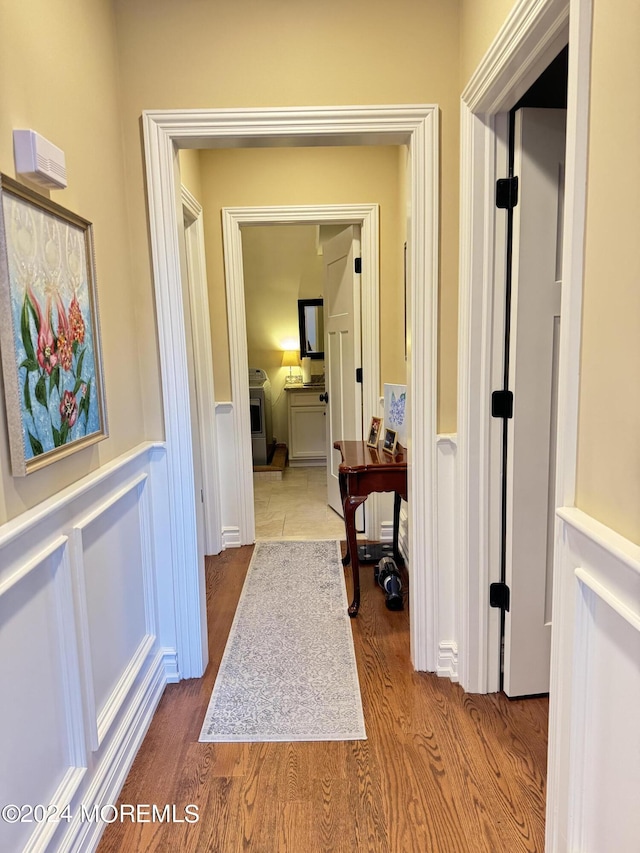 5-4 Main St, Oceanport, NJ 07757 - hallway featuring a wainscoted wall, wood finished floors, and a decorative wall