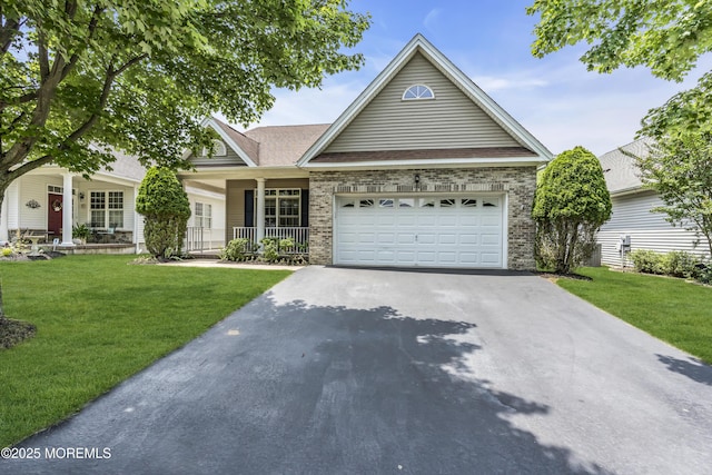 110 Rolling Meadows Blvd S, Ocean Twp, NJ 07712 - view of front of home with a porch, driveway, brick siding, and a front lawn