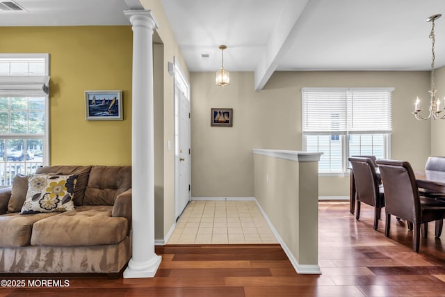 110 Rolling Meadows Blvd S, Ocean Twp, NJ 07712 - entryway featuring a chandelier, wood finished floors, and ornate columns