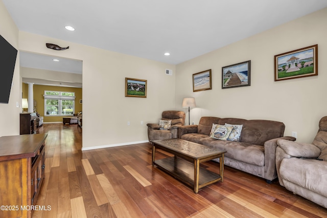 110 Rolling Meadows Blvd S, Ocean Twp, NJ 07712 - living area featuring wood finished floors, recessed lighting, and decorative columns