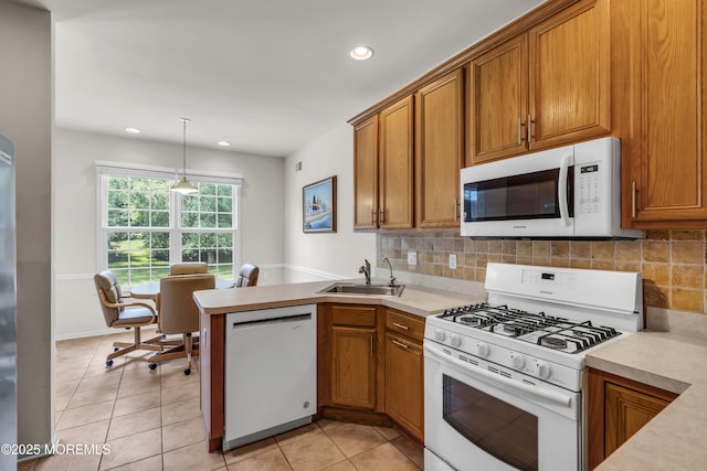 110 Rolling Meadows Blvd S, Ocean Twp, NJ 07712 - kitchen with white appliances, brown cabinetry, recessed lighting, light countertops, and light tile patterned floors