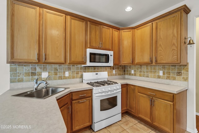 110 Rolling Meadows Blvd S, Ocean Twp, NJ 07712 - kitchen featuring white appliances, light countertops, decorative backsplash, and brown cabinets