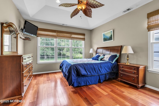 110 Rolling Meadows Blvd S, Ocean Twp, NJ 07712 - bedroom featuring a raised ceiling, light wood finished floors, multiple windows, and ceiling fan