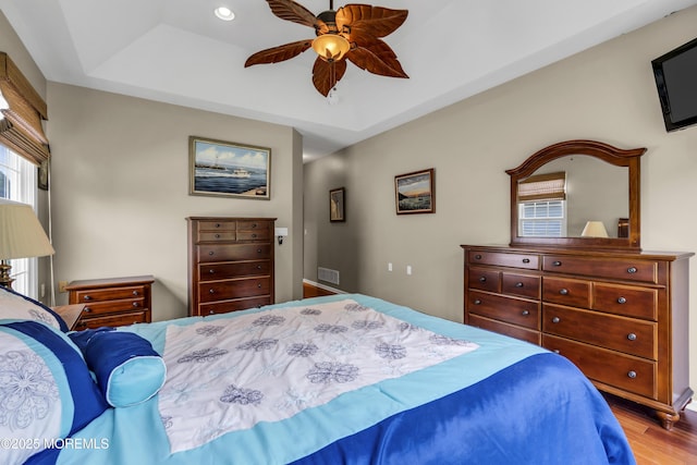 110 Rolling Meadows Blvd S, Ocean Twp, NJ 07712 - bedroom with wood finished floors, a tray ceiling, a ceiling fan, and recessed lighting