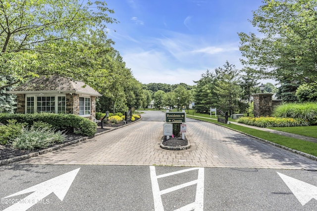 110 Rolling Meadows Blvd S, Ocean Twp, NJ 07712 - view of street featuring curbs, a gated entry, and sidewalks