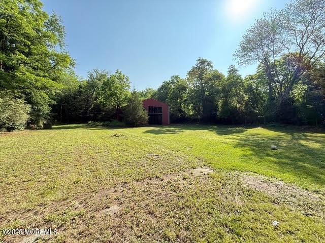 626 N County Line Rd, Jackson, NJ 08527 - view of grassy yard featuring an outbuilding and an outdoor structure