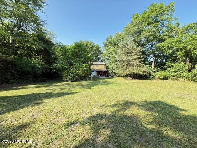 626 N County Line Rd, Jackson, NJ 08527 - view of grassy yard with a forest view