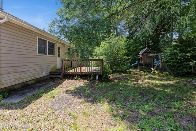 214 Conifer Dr, Forked River, NJ 08731 - view of yard with a playground and a wooden deck