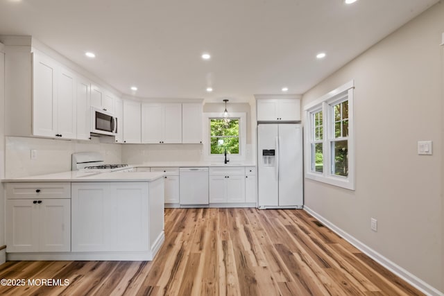 23 Bittner Rd, Millstone, NJ 08535 - kitchen with white appliances, healthy amount of natural light, white cabinetry, and recessed lighting