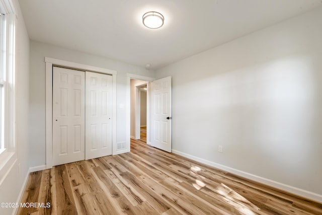 23 Bittner Rd, Millstone, NJ 08535 - unfurnished bedroom with a closet and light wood-style flooring