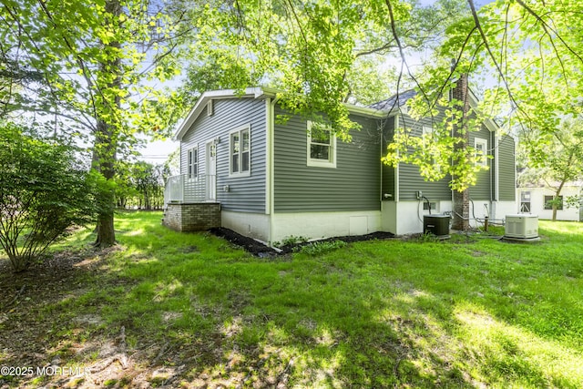 23 Bittner Rd, Millstone, NJ 08535 - view of side of property with a chimney and a yard