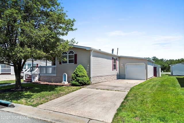 1104 Sycamore Ct, Whiting, NJ 08759 - view of front of house with a front lawn, a garage, concrete driveway, and covered porch