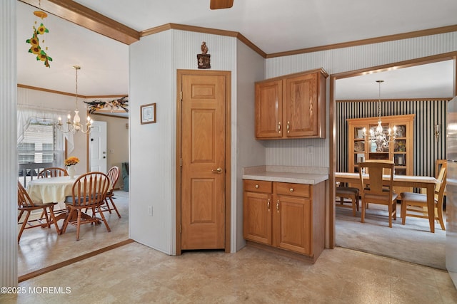 1104 Sycamore Ct, Whiting, NJ 08759 - kitchen featuring a chandelier, crown molding, light countertops, decorative light fixtures, and brown cabinets