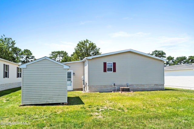 1104 Sycamore Ct, Whiting, NJ 08759 - back of house featuring a lawn and a storage shed
