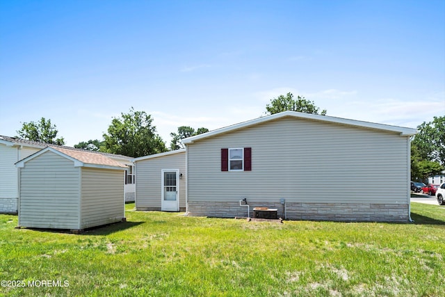 1104 Sycamore Ct, Whiting, NJ 08759 - rear view of house with a yard and a storage shed