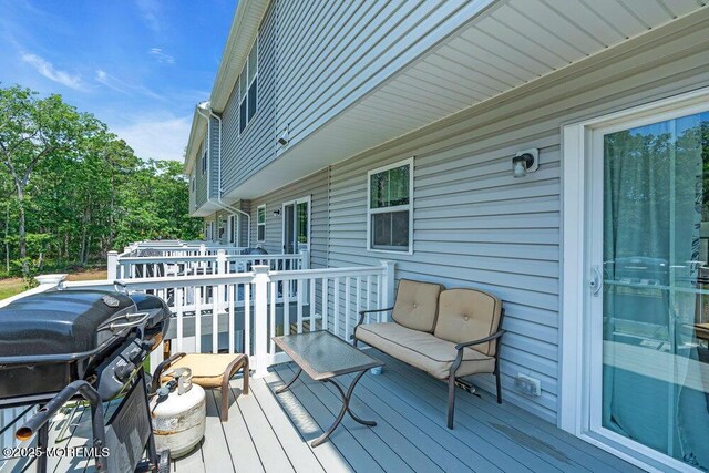 703 Cyprus Ct, Forked River, NJ 08731 - wooden terrace featuring a grill