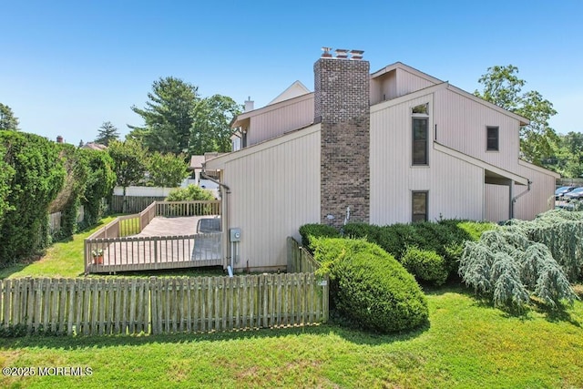 1120 Pennsylvania Ave, Manasquan, NJ 08736 - view of side of property with a chimney and a deck