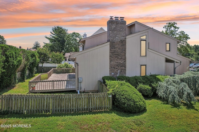 1120 Pennsylvania Ave, Manasquan, NJ 08736 - property exterior at dusk with a chimney and a deck