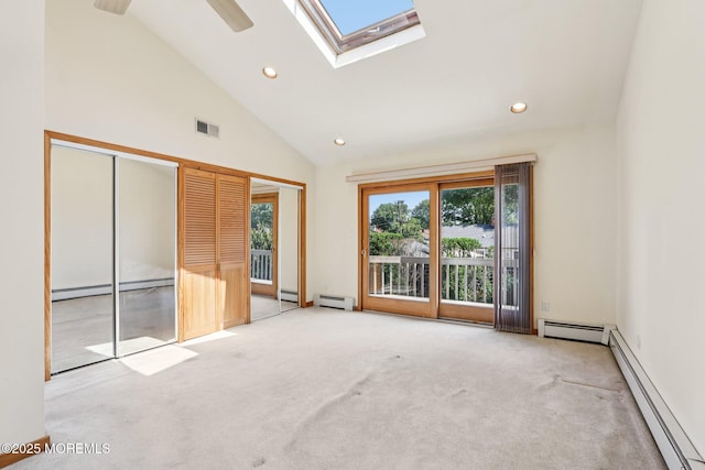 1120 Pennsylvania Ave, Manasquan, NJ 08736 - unfurnished room with a baseboard heating unit, a skylight, carpet floors, recessed lighting, and high vaulted ceiling