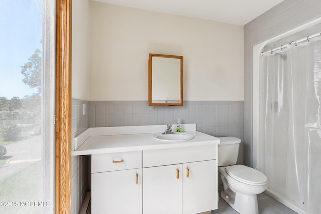 1120 Pennsylvania Ave, Manasquan, NJ 08736 - bathroom with vanity, tile walls, tile patterned flooring, curtained shower, and wainscoting