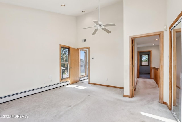 1120 Pennsylvania Ave, Manasquan, NJ 08736 - spare room with light carpet, baseboard heating, ceiling fan, a high ceiling, and recessed lighting