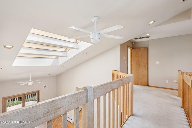 1120 Pennsylvania Ave, Manasquan, NJ 08736 - corridor with a skylight, an upstairs landing, light colored carpet, lofted ceiling, and recessed lighting