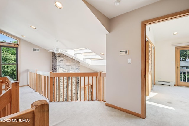 1120 Pennsylvania Ave, Manasquan, NJ 08736 - corridor featuring carpet, a baseboard radiator, lofted ceiling, recessed lighting, and a skylight