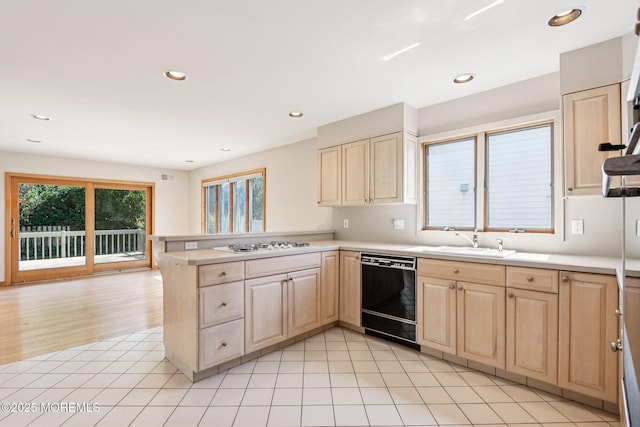 1120 Pennsylvania Ave, Manasquan, NJ 08736 - kitchen featuring dishwasher, light brown cabinets, a peninsula, light countertops, and white gas cooktop
