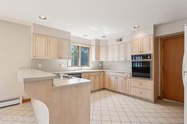 1120 Pennsylvania Ave, Manasquan, NJ 08736 - kitchen featuring oven, light brown cabinets, a peninsula, a baseboard heating unit, and light countertops