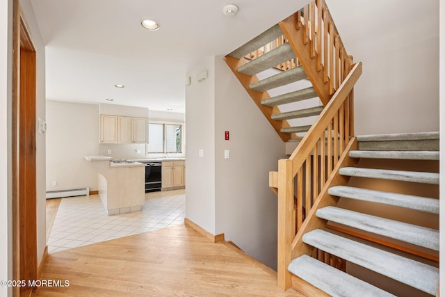 1120 Pennsylvania Ave, Manasquan, NJ 08736 - stairway with a baseboard heating unit, recessed lighting, and tile patterned flooring