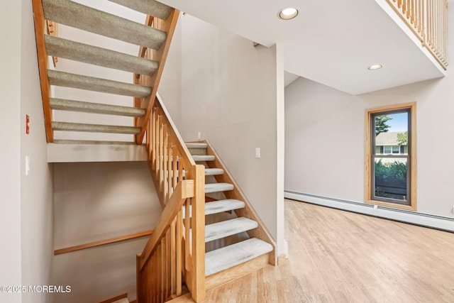 1120 Pennsylvania Ave, Manasquan, NJ 08736 - stairs with a baseboard heating unit, wood finished floors, and recessed lighting