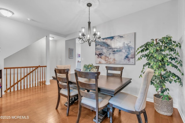 249 Chickadee Ct Unit 1000, Freehold, NJ 07728 - dining space featuring a chandelier and hardwood / wood-style floors