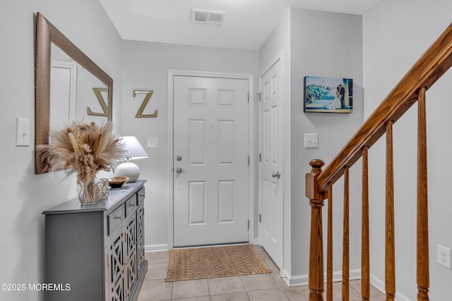 249 Chickadee Ct Unit 1000, Freehold, NJ 07728 - entryway featuring light tile patterned floors and stairs