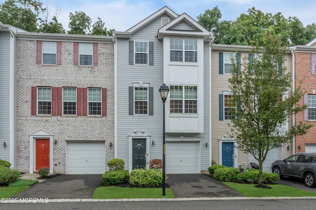 249 Chickadee Ct Unit 1000, Freehold, NJ 07728 - view of property featuring driveway and a garage