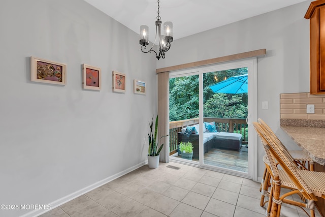 249 Chickadee Ct Unit 1000, Freehold, NJ 07728 - dining area featuring a chandelier and light tile patterned floors