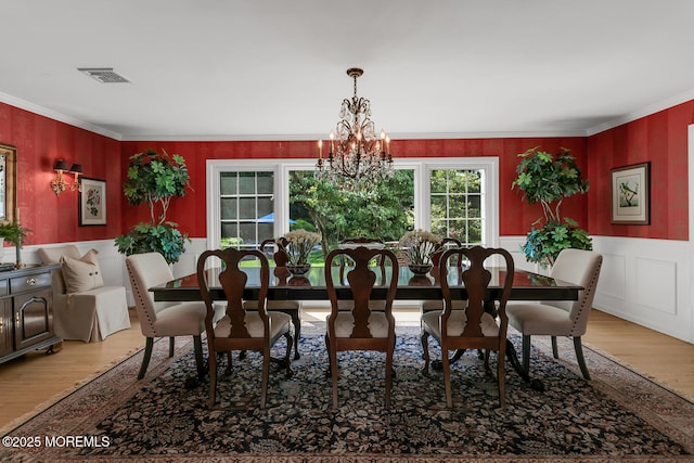 1 Van Cir, Rumson, NJ 07760 - dining room featuring crown molding, wood finished floors, a chandelier, and a wainscoted wall