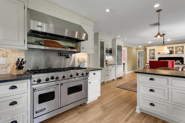 1 Van Cir, Rumson, NJ 07760 - kitchen featuring appliances with stainless steel finishes, dark countertops, range hood, crown molding, and white cabinetry