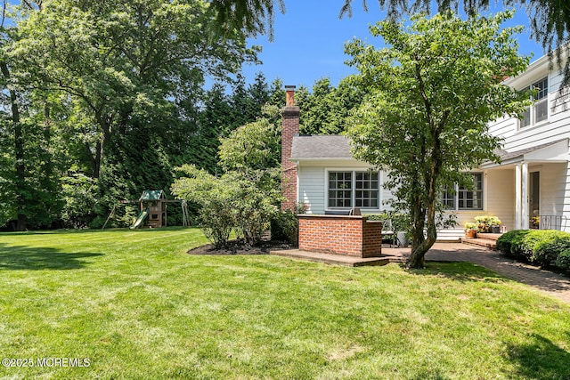 1 Van Cir, Rumson, NJ 07760 - view of green lawn featuring a playground and a patio area