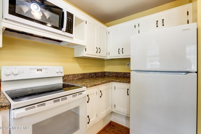 111 Edinburgh Ln Unit D, Lakewood, NJ 08701 - kitchen with white appliances, white cabinets, dark countertops, and wood finished floors