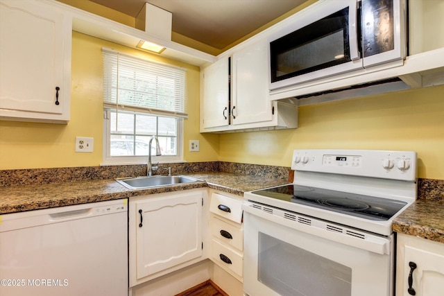 111 Edinburgh Ln Unit D, Lakewood, NJ 08701 - kitchen with white appliances, dark countertops, and white cabinetry