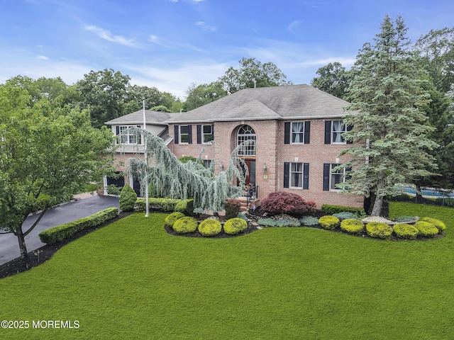 1020 Aumack Rd, Jackson, NJ 08527 - view of front of home featuring a front lawn, brick siding, and stairs