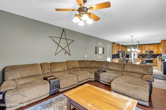 1020 Aumack Rd, Jackson, NJ 08527 - living room featuring light wood-style flooring, ceiling fan, and a chandelier