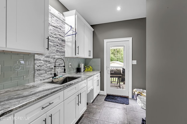1020 Aumack Rd, Jackson, NJ 08527 - kitchen with backsplash, white cabinets, light stone counters, recessed lighting, and tile patterned floors