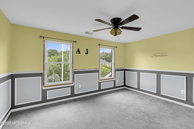 1020 Aumack Rd, Jackson, NJ 08527 - carpeted empty room featuring a wainscoted wall, a ceiling fan, and a decorative wall