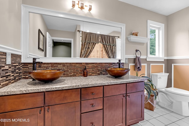 1020 Aumack Rd, Jackson, NJ 08527 - full bath with double vanity, decorative backsplash, tile patterned floors, and a shower with shower curtain