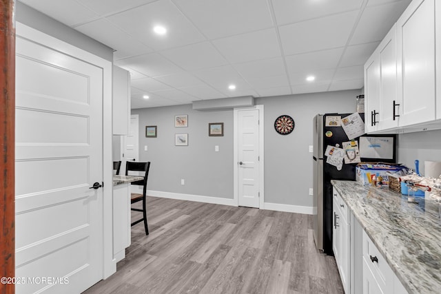 1020 Aumack Rd, Jackson, NJ 08527 - kitchen with a drop ceiling, white cabinets, light wood-type flooring, light stone counters, and recessed lighting